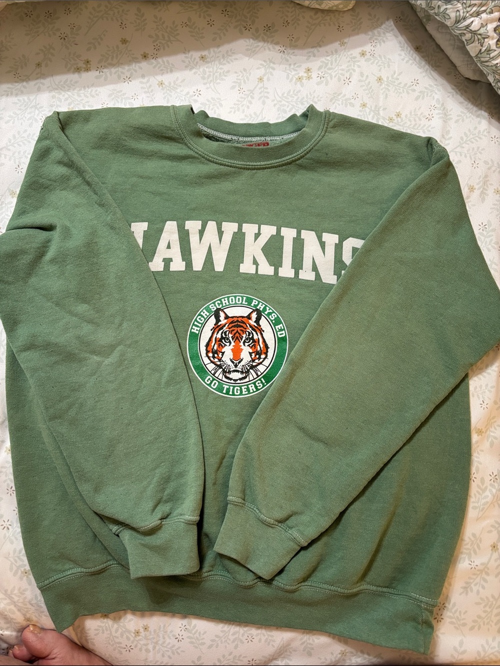Urban Outfitters Hawkins Stranger Things crewneck sweatshirt features a white